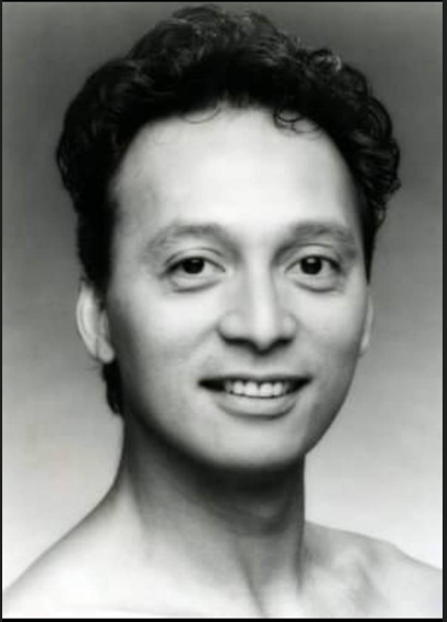 A person smiling at the camera Description automatically generated